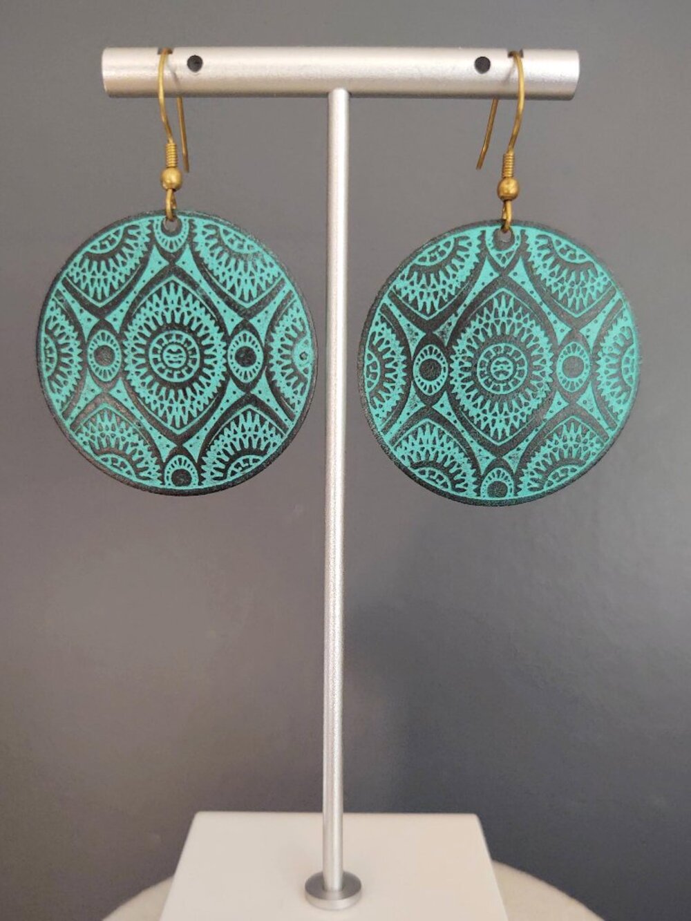 Green and black metal disk earrings